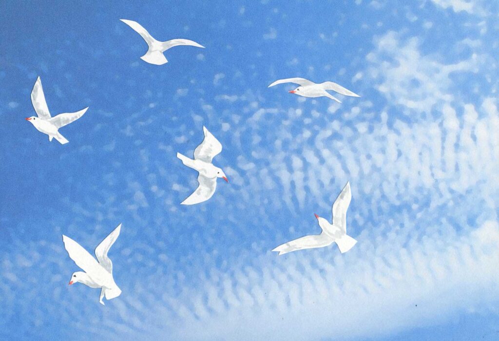 paper cut seagulls on a photoshopped photo of sky